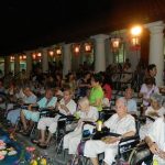 Patients enjoying moon cakes and festive foodstuffs donated by volunteers